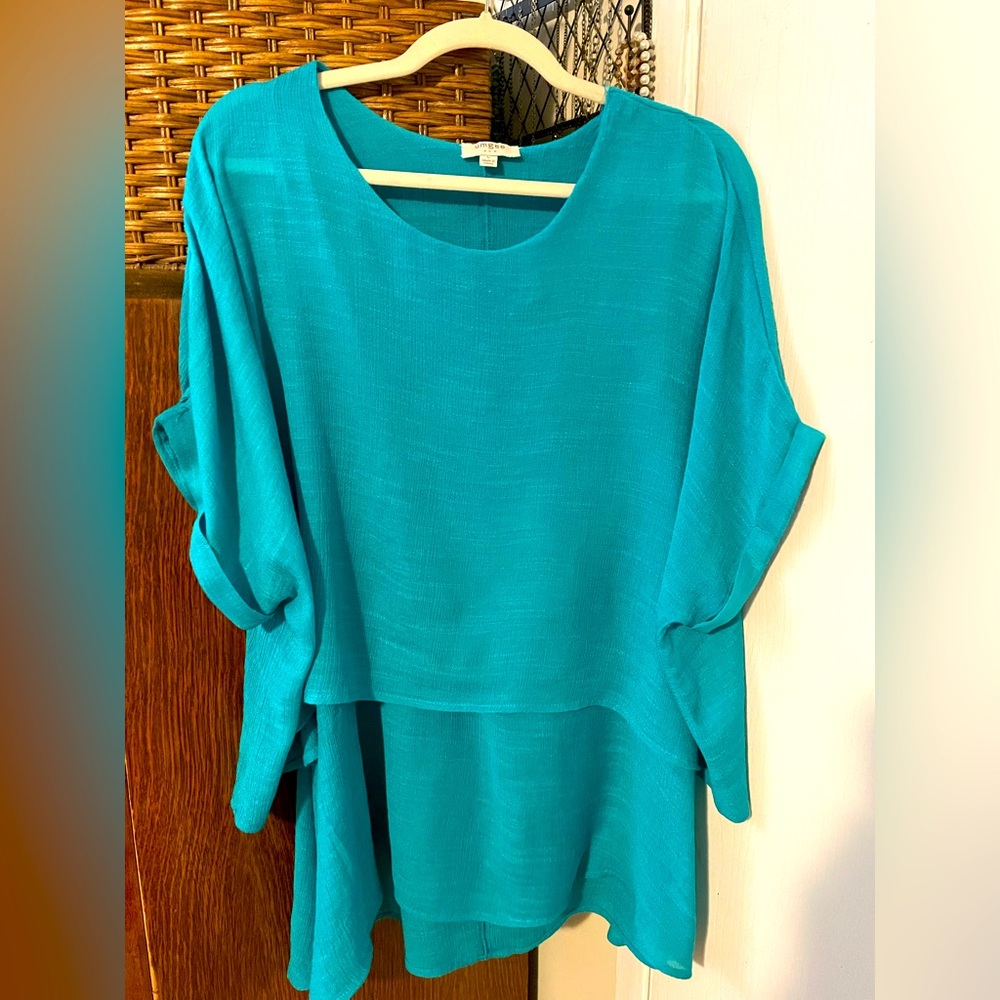 Eye catching, turquoise, blouse.